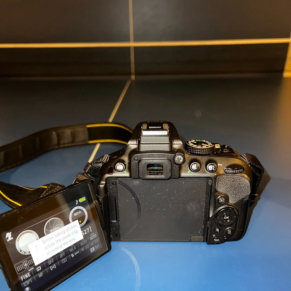 Nikon d5300, 55mm,200mm battery and charger. Camera bag included